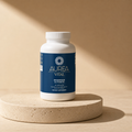 Aurea Vital Magnesium Glycinate in a warm travertine studio setting.